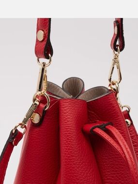 Women’s Red Leather Drawstring Shoulder Bag with Gold Hardware